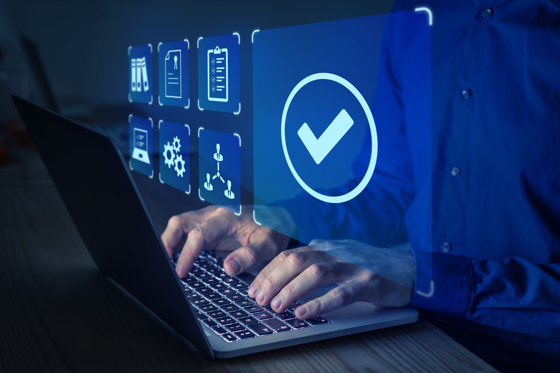 Person works on a laptop and accesses network technologies.