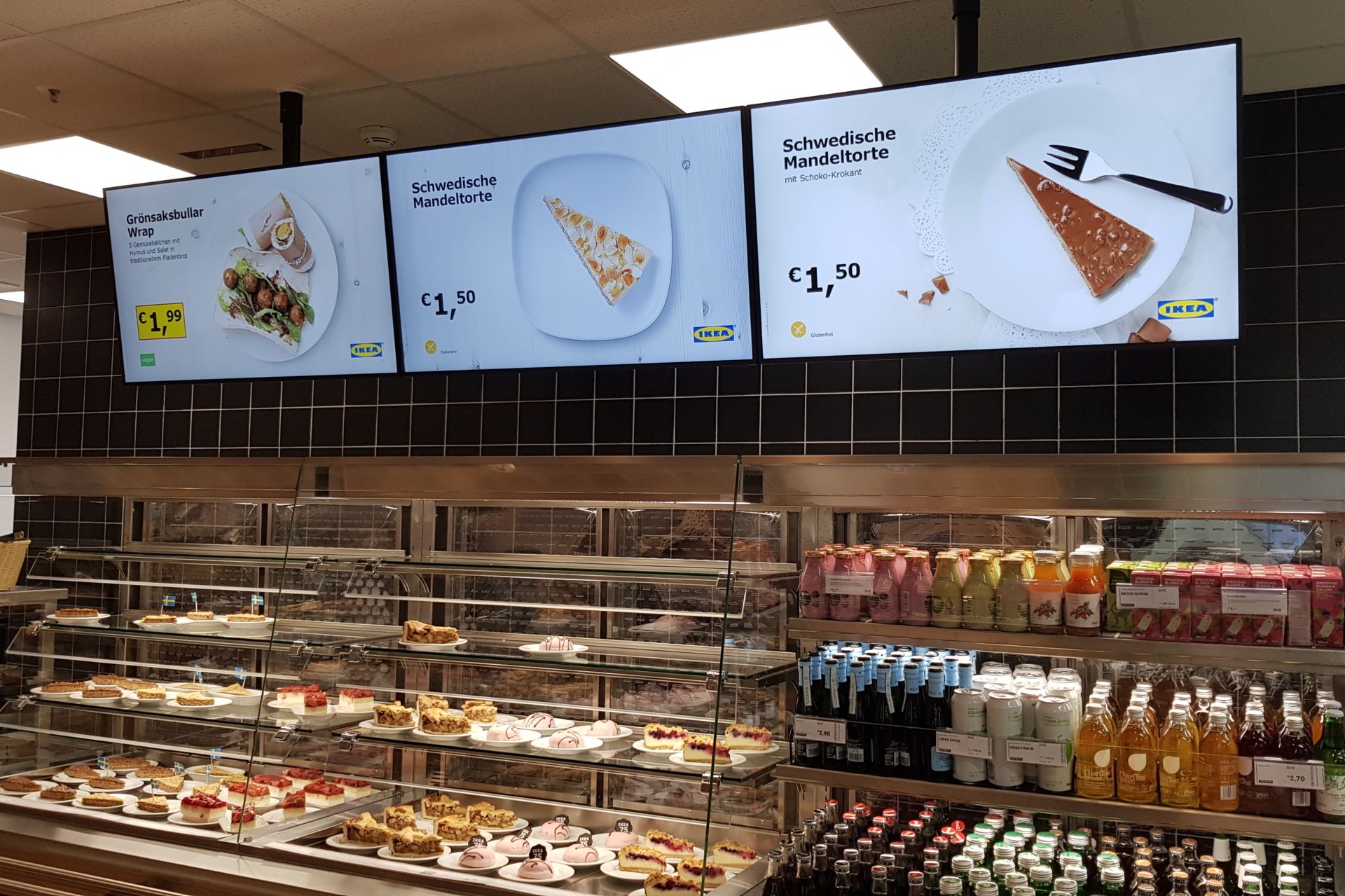 Food on shelves in a supermarket, shown on a digital signage display from CANCOM.
